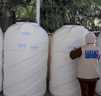  Delivering Vital Water Barrels to Jenin