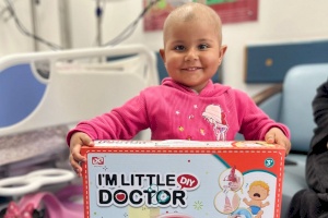 A Happy Girl with Her New Toy at Huda Al Masri Department