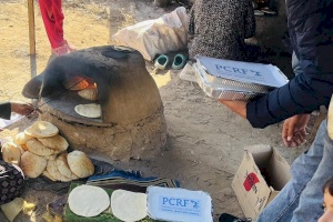 Mother Baking Bread While Receiving Hot Meals for Her Children