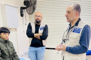 Doctors Conducting Medical Assessments for Children in Jordan