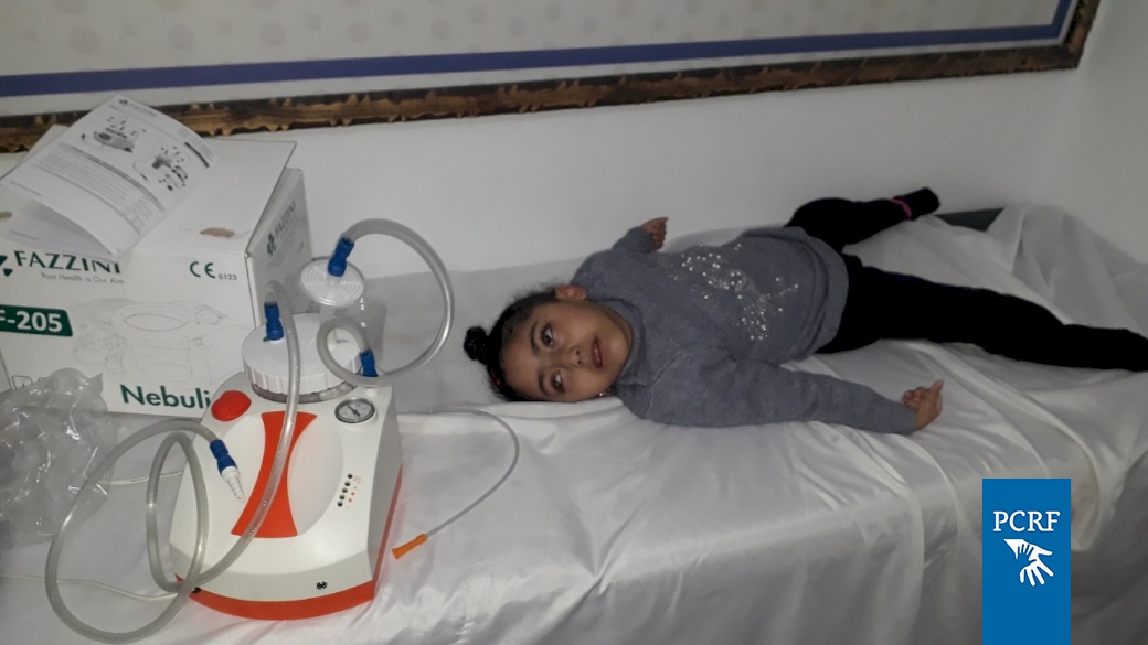 PCRF Provide Suction Machine to Child in Gaza